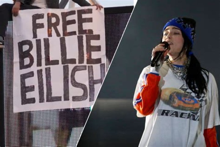 
Man climbs 162-foot KTLA tower in California with guitar, holding ‘Free Billie Eilish’ sign 